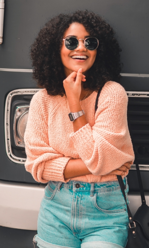 Jane leaning against a bus